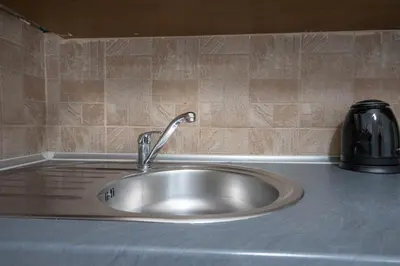 a stainless steel sink in a kitchen counter at Petralona Hideaway - Comfort for 4 by ΜΡS in Athens