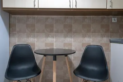 two black chairs and a table in a kitchen at Petralona Hideaway - Comfort for 4 by ΜΡS in Athens