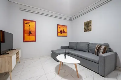 a living room with a couch and a table at Petralona Hideaway - Comfort for 4 by ΜΡS in Athens