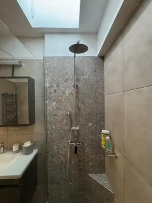 a bathroom with a shower and a sink at East Side of Acropolis in Athens