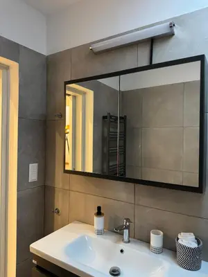 a bathroom with a sink and a mirror at East Side of Acropolis in Athens