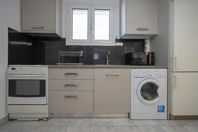 a kitchen with a washing machine and a dishwasher at Metaxourgeio Metro Apartment-Comfort for 3 by ΜΡS in Athens