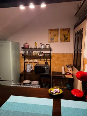 a kitchen with a counter with a microwave and a refrigerator at Vintage Studio - Great for Travelers in Transit in Koropíon
