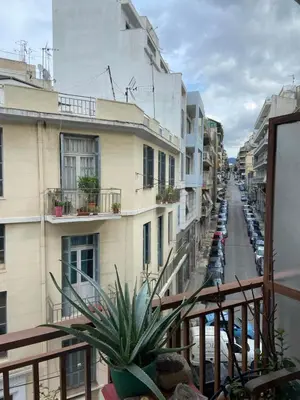 a view of a city street from a balcony at Sunny room in the heart of the city in Athens