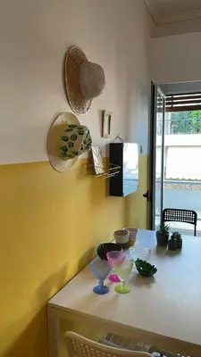 a kitchen with a table with glasses on it at Acropolis Happy Place in Athens