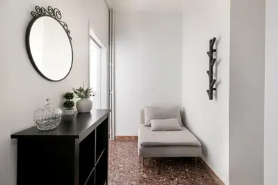 a room with a mirror and a chair and a table at Serenity - 1-BR Apartment in Zografou in Athens