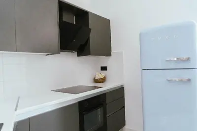 a kitchen with a blue refrigerator and a stove at One&Only apartment in Athens