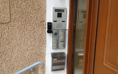 a phone on a wall next to a door at Four Seasons Cozy Apartment Paleo Faliro South Ath in Athens