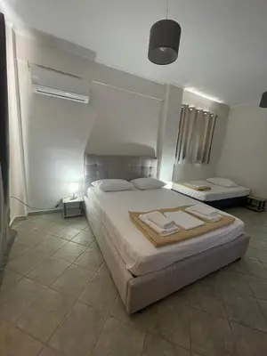 a bedroom with a large bed in a room at RunWay Stay-24h self check in- Athens Airport in Porto Rafti