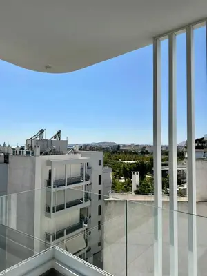 a view from the balcony of a building at Niarchos Park View Maisonette in Athens