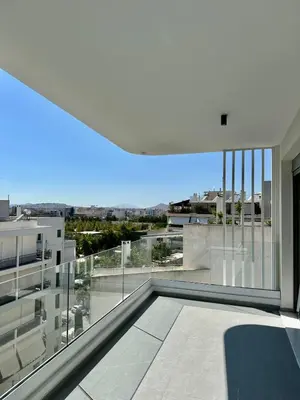 a balcony with a view of a building at Niarchos Park View Maisonette in Athens