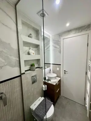 a bathroom with a toilet and a sink at Niarchos Park View Maisonette in Athens