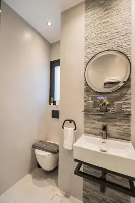 a bathroom with a sink and a mirror at The Athenian Spot in Athens
