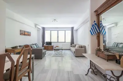 a living room with a couch and a table at Acropolis Monastiraki Psiri Central Apartment in Athens