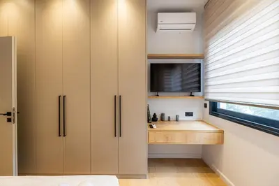 a kitchen with white cabinets and a sink at Rooms151 Smart Suite in the Heart of Athens 2nd floor 4B in Athens