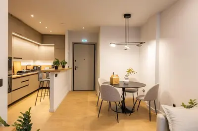 a kitchen and dining room with a table and chairs at Rooms151 Smart Suite in the Heart of Athens 2nd floor 4B in Athens