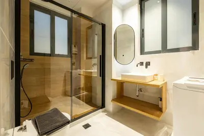 a bathroom with a shower and a sink at Rooms151 Smart Suite in the Heart of Athens 2nd floor-4S in Athens