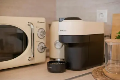 a kitchen counter with a coffee maker and a microwave at Modern Beach Retreat 2BR in Coastal Palaio Faliro in Athens