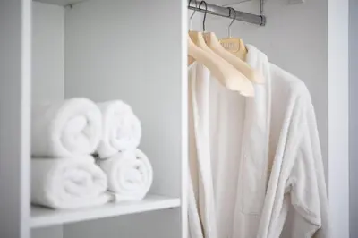 a towel hanging on a rack next to towels at Supreme Aprt Syntagma Kolonaki in Athens