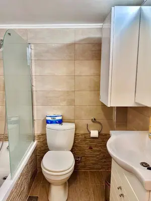 a bathroom with a toilet and a sink at Smirni Snug Stay Garden Fits 4 in Athens