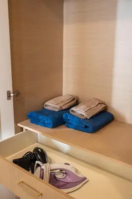two towels sitting on a shelf in a room at 42sqm - Private Parking - Central - Big Balcony Luma in Athens