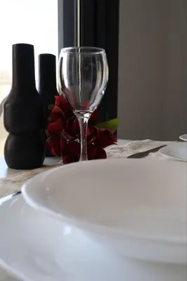 a wine glass sitting on top of a table at Athenean Porto Pireaus Suites-B1 in Piraeus