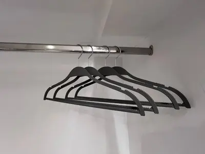 a black hanger hanging from a ceiling at MetroSide & Concert Hall Studio by ΜΡS in Athens