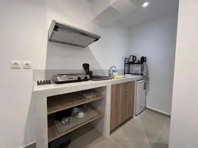 a small kitchen with a sink and a stove at MetroSide & Concert Hall Studio by ΜΡS in Athens