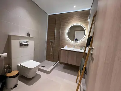 a bathroom with a toilet and a sink and a mirror at MetroSide & Concert Hall Studio by ΜΡS in Athens
