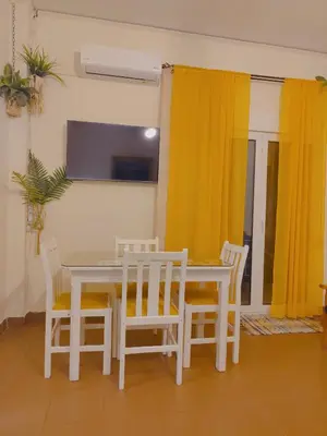 a dining room with a white table and chairs at Old area of Athens in Athens