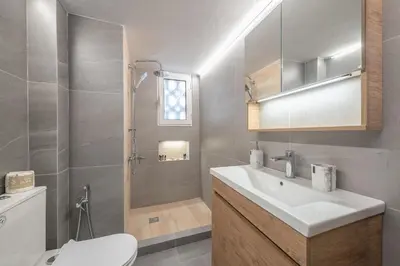 a bathroom with a sink and a toilet and a shower at Eudoxus Haus in Athens