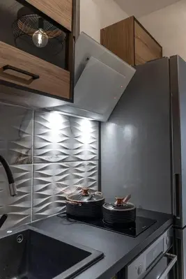 a kitchen with two pans on top of a stove at Staiko Apartment in Athens