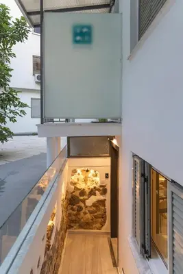 a hallway leading into a building with a door at Staiko Apartment in Athens