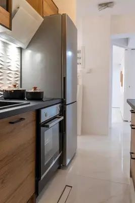 a kitchen with a large stainless steel refrigerator at Staiko Apartment in Athens