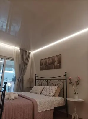 a bedroom with a bed and a window at Modern familiar house under Acropolis in Athens