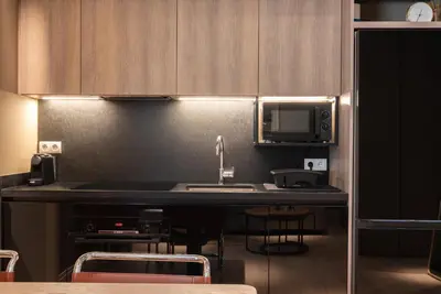 a kitchen with a sink and a microwave at Syntagma Zairas Hideaway! in Athens
