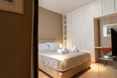 a bedroom with a bed with towels on it at Syntagma Zairas Hideaway! in Athens