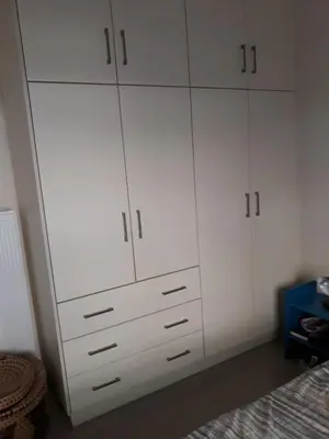 a white closet with white cabinets in a bedroom at 2room-flat, perfect kitchen in Athens, Pangkrati 100Μbits in Athens