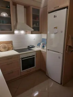 a kitchen with a white refrigerator and a stove at 2room-flat, perfect kitchen in Athens, Pangkrati 100Μbits in Athens