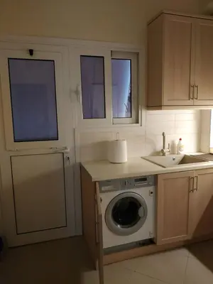 a kitchen with a washing machine and a sink at 2room-flat, perfect kitchen in Athens, Pangkrati 100Μbits in Athens