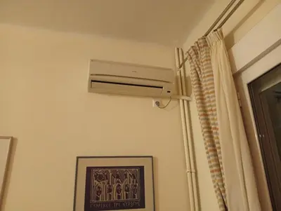 a air conditioner on a wall in a room at Athens Panormou station in Athens