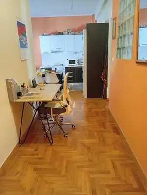 an office with a desk and a computer on a wooden floor at Athens Panormou station in Athens