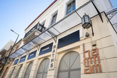 a building with a sign on the side of it at The Saints Inn in Athens