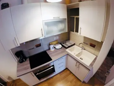 a small kitchen with a sink and a microwave at Acropolis Cozy Apartment in Athens