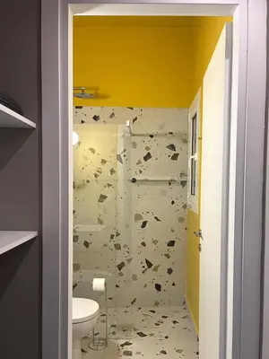 a bathroom with a shower and a toilet in it at Acropolis Lane in Athens