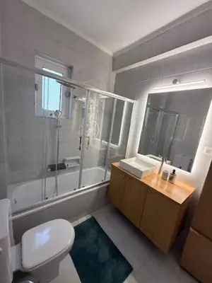 a bathroom with a toilet and a shower and a sink at Avra Deluxe Apartment in Athens