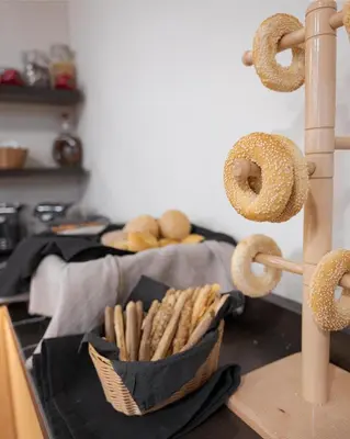 a bowl of bagels and a basket of bagels at Acropolis Select in Athens