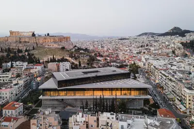 a view of a city with a building at Acropolis Select in Athens