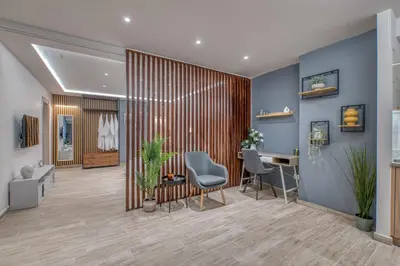 a lobby with a desk and chairs in a room at The Garden of Eden Apartment in Piraeus
