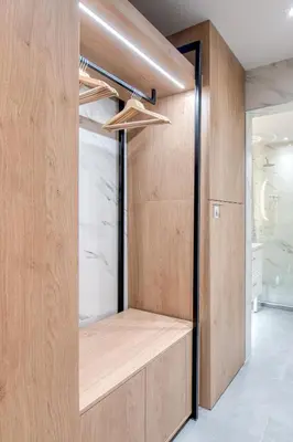 a room with a closet with wooden walls at The Garden of Eden Apartment in Piraeus